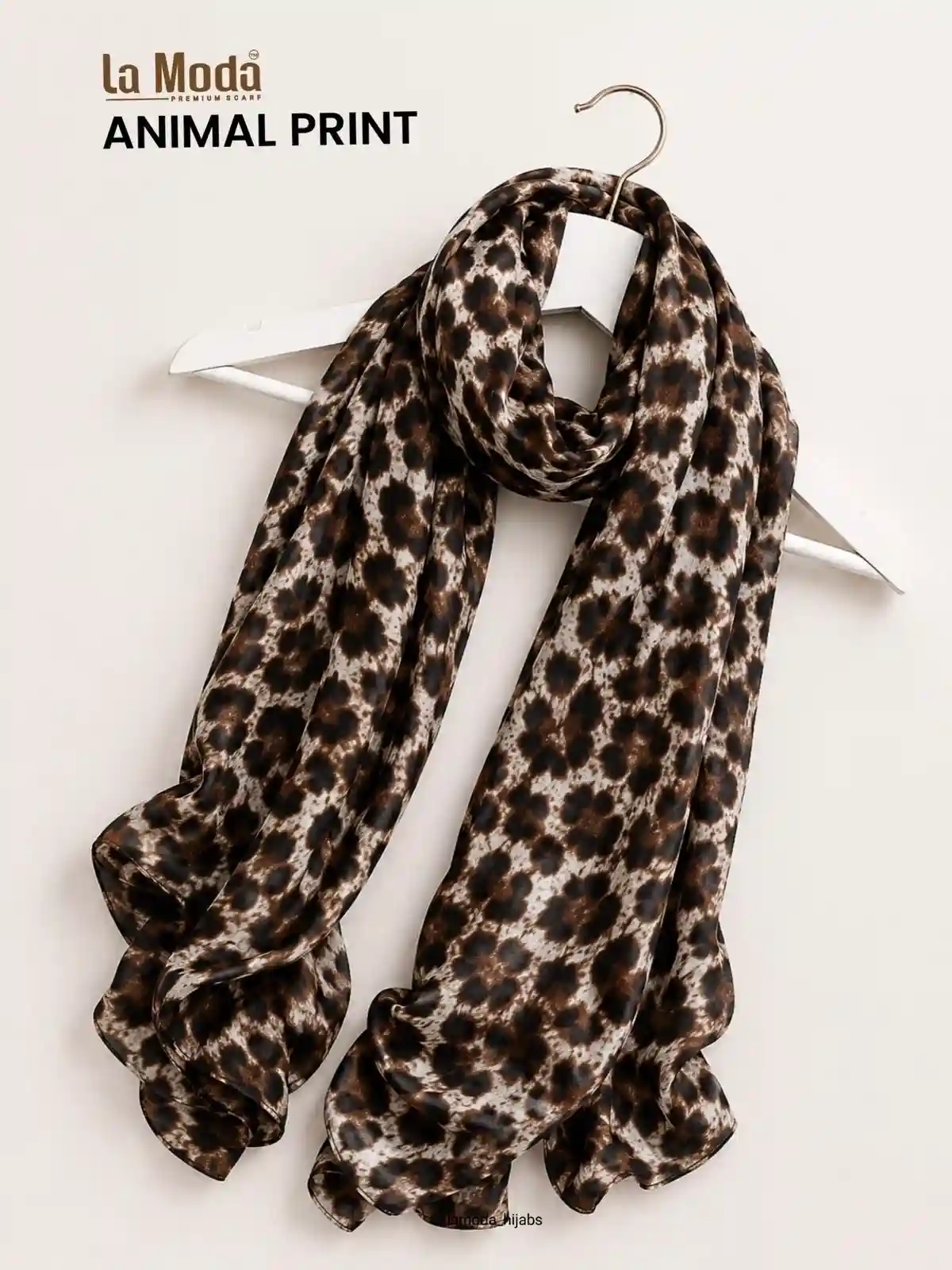 La Moda leopard print hijab in modal cotton draped on a hanger — premium animal print scarf