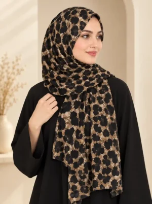 La Moda cheetah print hijab in light chiffon with large solid spots, styled over a plain abaya