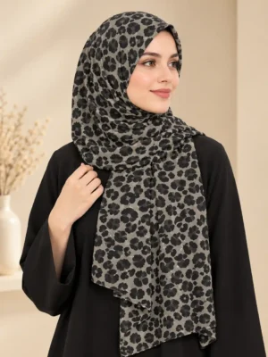 La Moda animal print scarf in chiffon with a muted base and darker spots, worn as a hijab